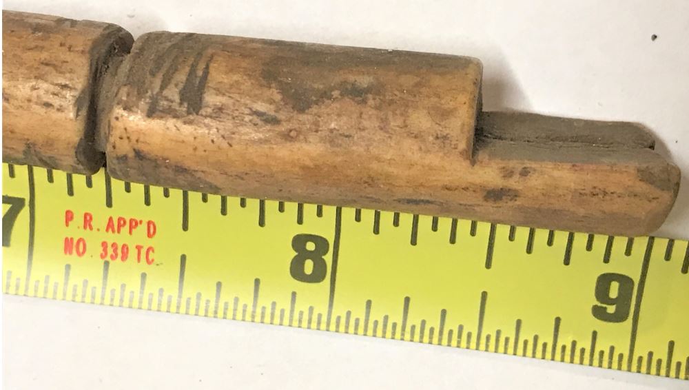 Third photo of a partially made powder measure based on a deer antler.