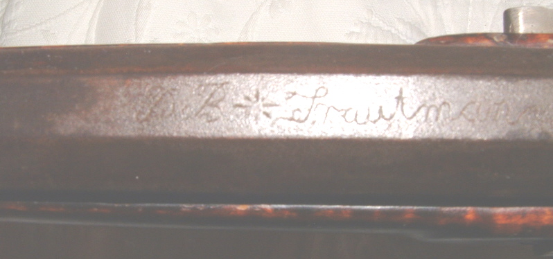 This shows Daniel Benjamin Troutman's signature on the top flat of the barrel of a rifle he built. He was a gunsmith in Somerset and Bedford Counties, Pennsylvania before moving west to Franklin County, Kansas.