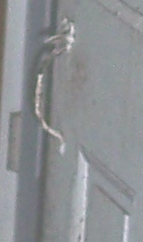 Door latch on hallway door.