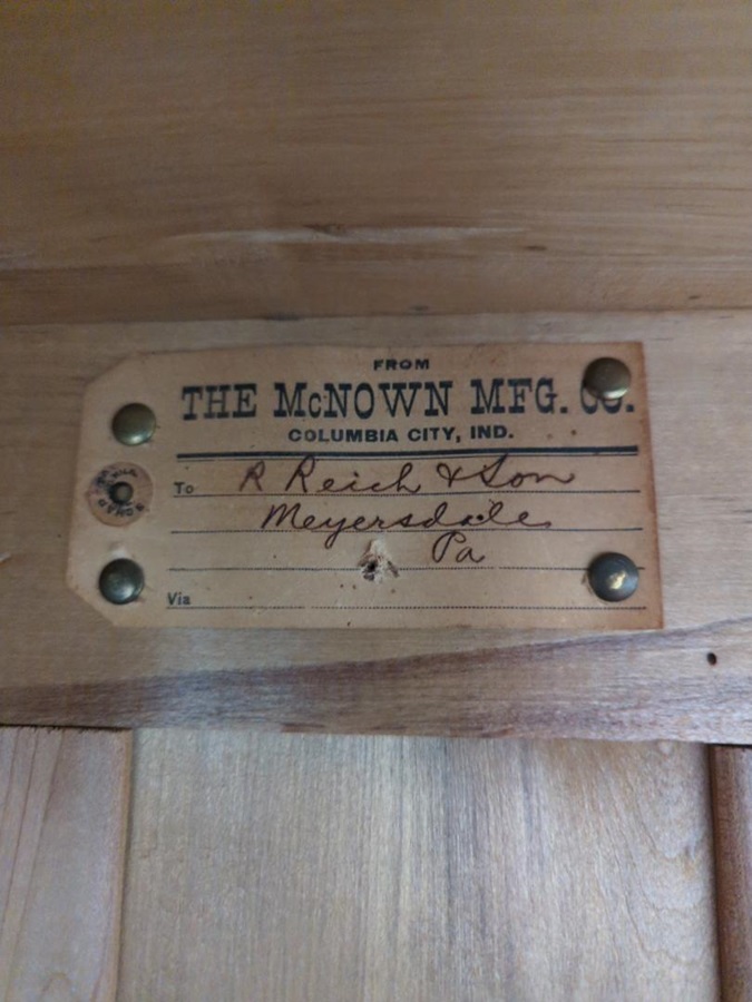 The manufacturer's tag on the inside of the hutch.