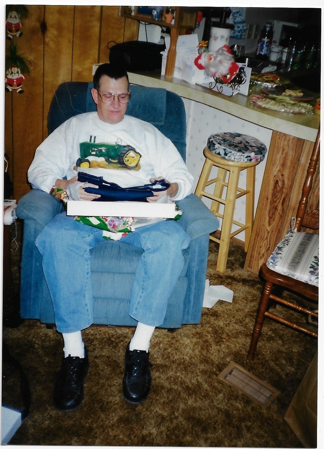 Ralph opening a Christmas present