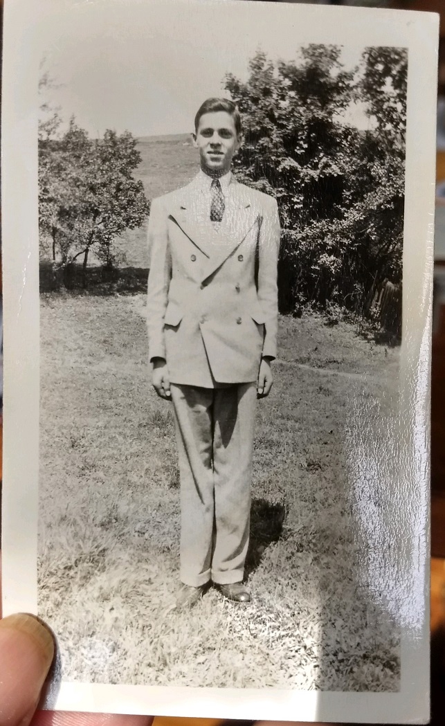 A youthful Roy Emerson Dietle posing in a light-colored suit on the home farm in Larimer Township, Somerset County, Pennsylvania.