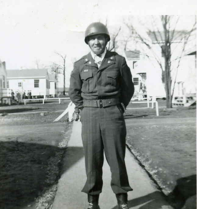 Luther Korns in his Army uniform, wearing a helmet.