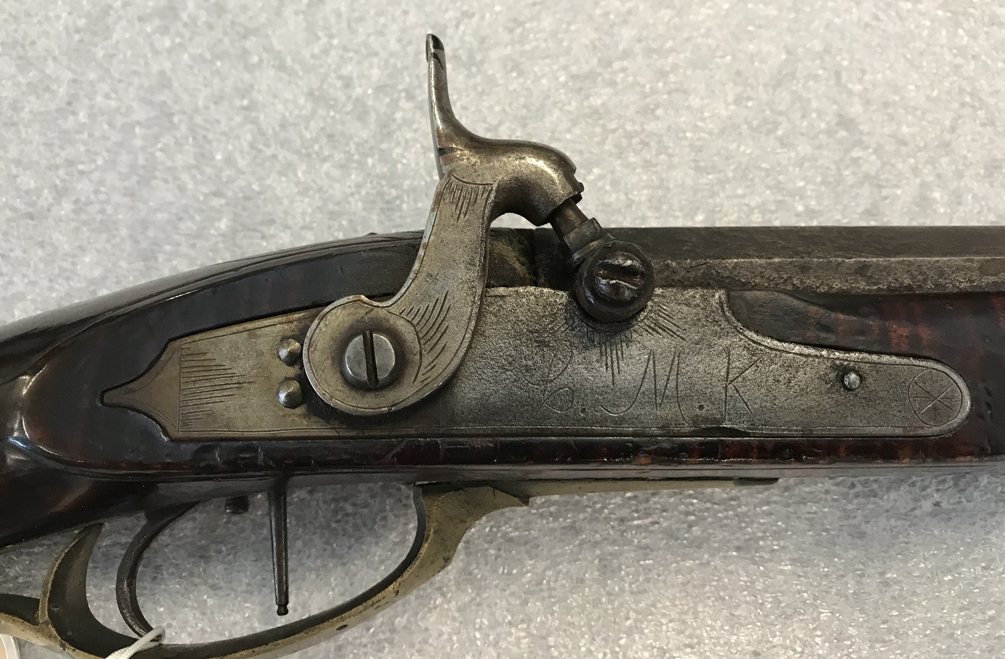A high resolution photo of the lock on an antique Somerset County, Pennsylvania rifle made by the riflemaker Charles Monroe Knupp.