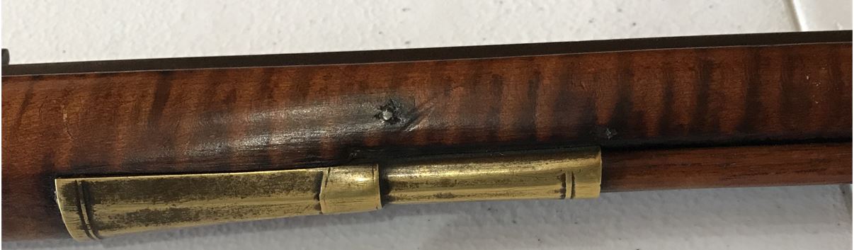 An oblique view of the ramrod entry pipe on the Defibaugh percussion rifle.