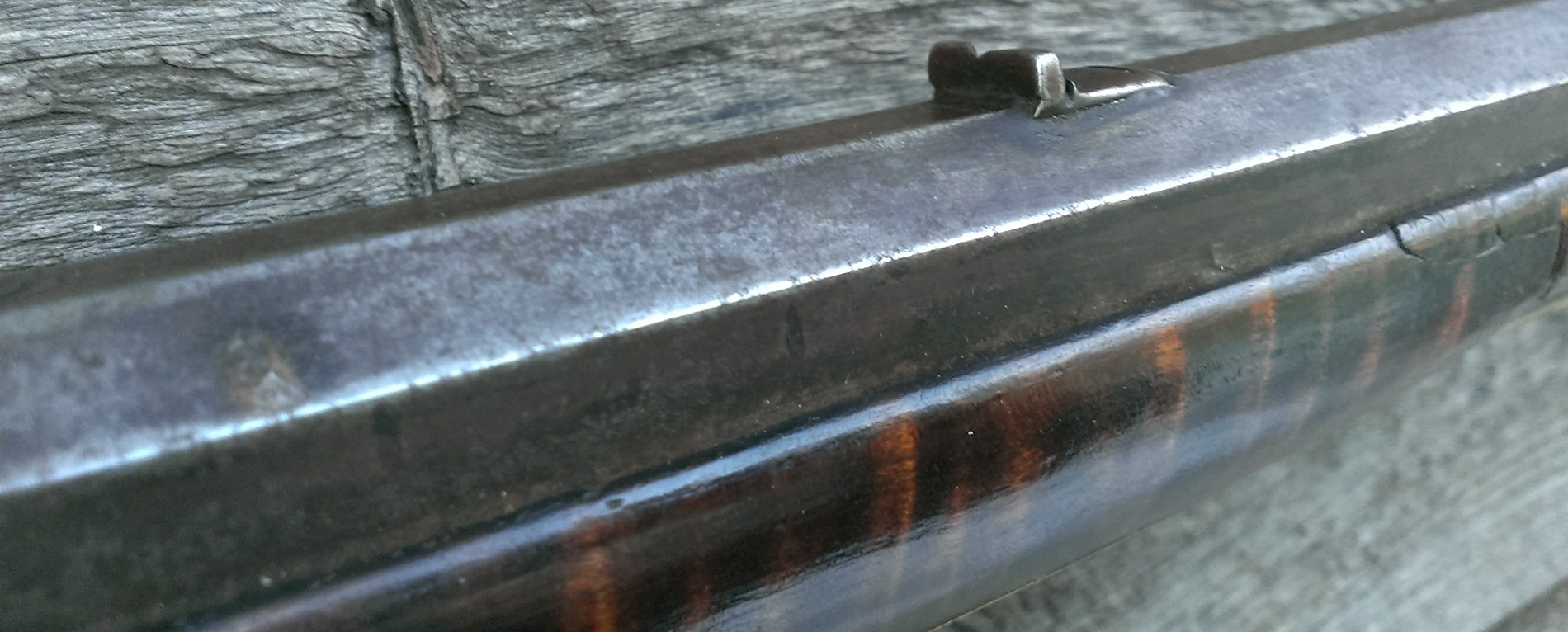 An oblique view of the rearward portion of the open back sight.