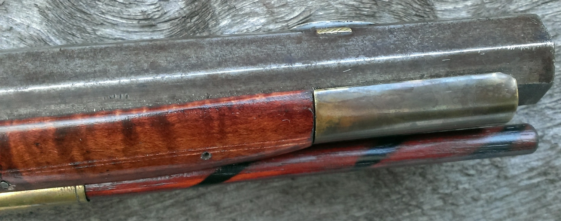 The right-hand side of the dovetailed, blade-type front sight.