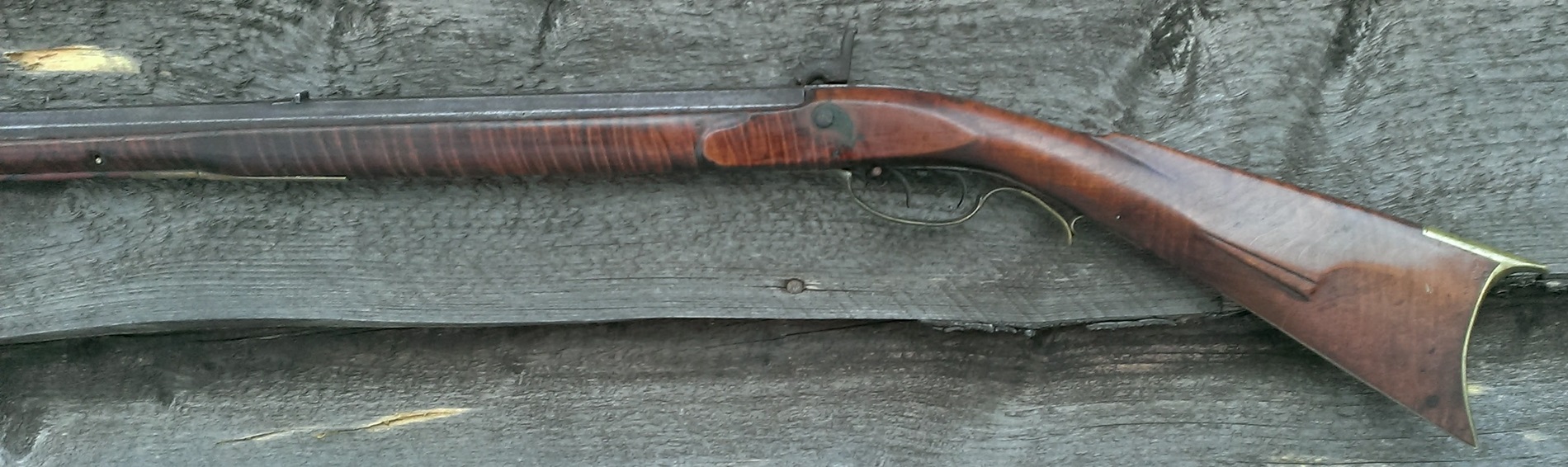 A photo of the rearward portion of the left-hand side of the rifle.