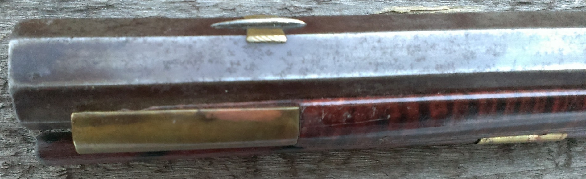 An oblique view of the forestock portion of the rifle.