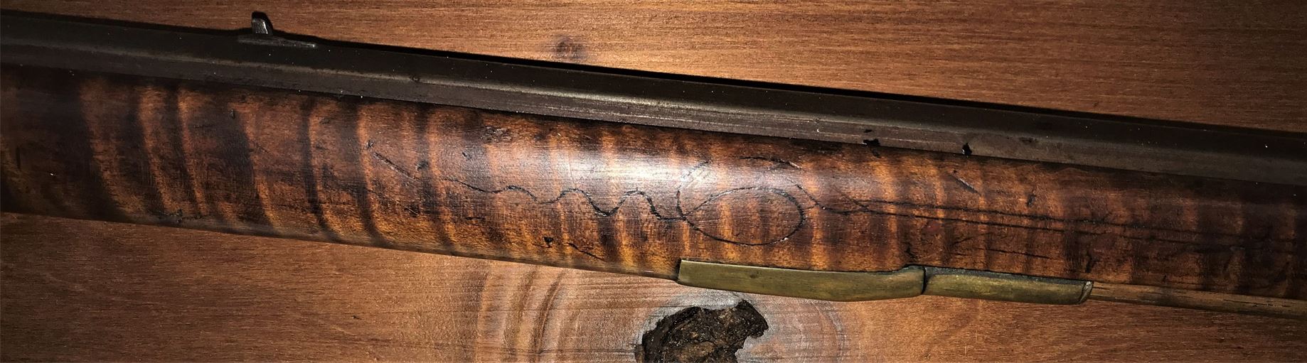 The ramrod entry pipe area of the Dormayer-style full stock muzzle loader.