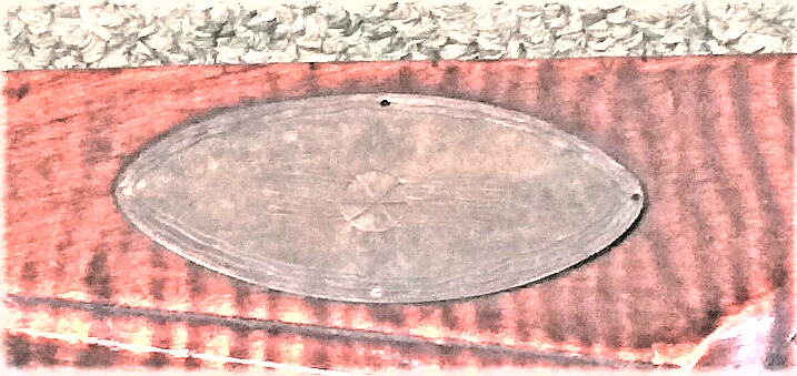 This shows the cheekpiece medallion on a percussion conversion rifle of the Bedford County school that was built by the gun maker Jacob Stoudenour.