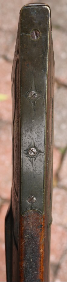 Photo of the buttstock toe plate on the John Amos percussion rifle.