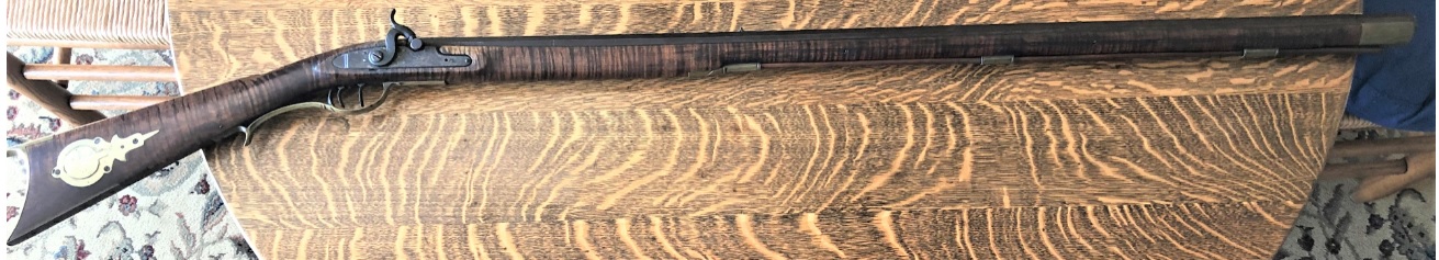 This photo shows the entire right-hand side of a percussion long rifle made by the Lepley family of Somerset County, Pennsylvania.