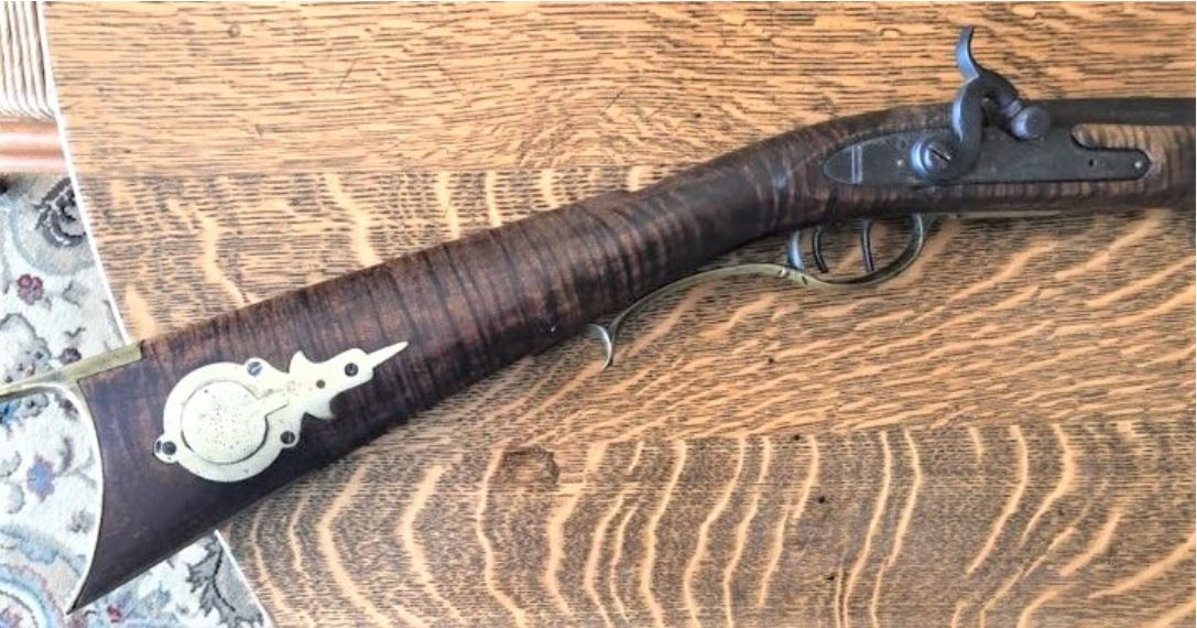 This photograph shows the lock, trigger guard, and buttstock regions of a Lepley-made Pennsylvania long rifle from Somerset County, Pennsylvania.