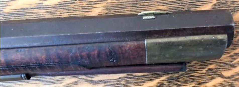 This is a photograph of the front sight and nose cap area of an antique black powder muzzle loader rifle that is a product of the Lepley gunmaker family of Somerset Co., PA.