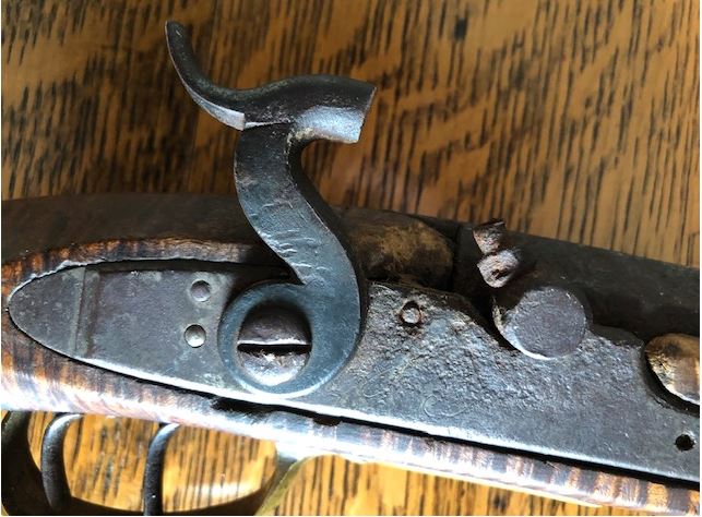 This photograph provides a side view of the percussion hammer on the Lepley long rifle.