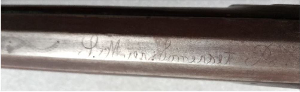 A photograph of the signature, and some of the barrel engraving on the Mier rifle.