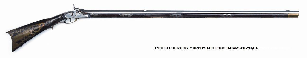This photo shows the right-hand-side of a plated Pennsylvania long rifle that is attributed to the gunsmith Peter Dormayer (Dunmeyer).