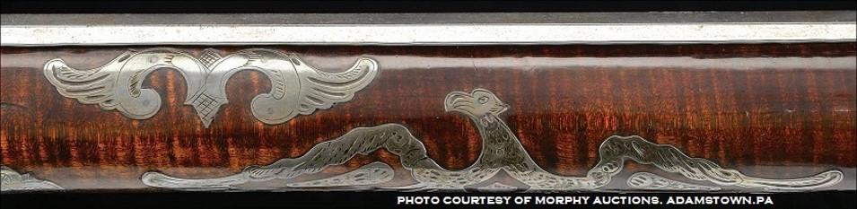This shows some forearm inlays on a rifle attributed to the gunmaker Peter Dormayer.