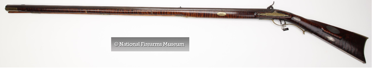 This picture shows the left-hand side of a percussion conversion long rifle that was produced by gun maker Peter White, who worked in Fayette and Bedford Counties, Pennsylvania.