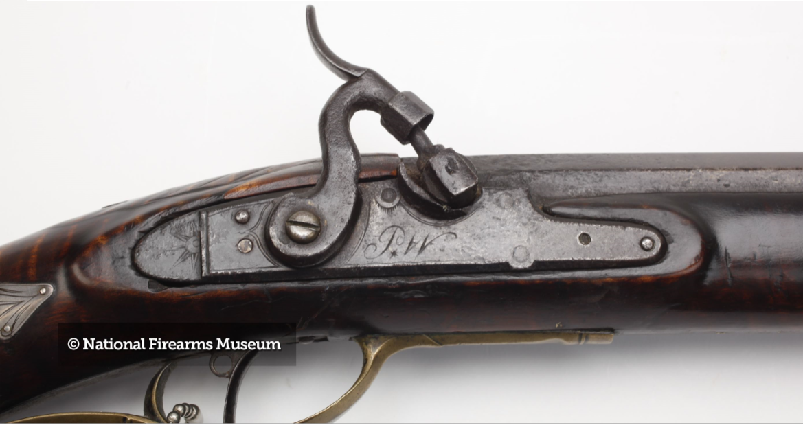 This photo highlights the converted lock on a fine example of a Peter White-made black powder rifle.