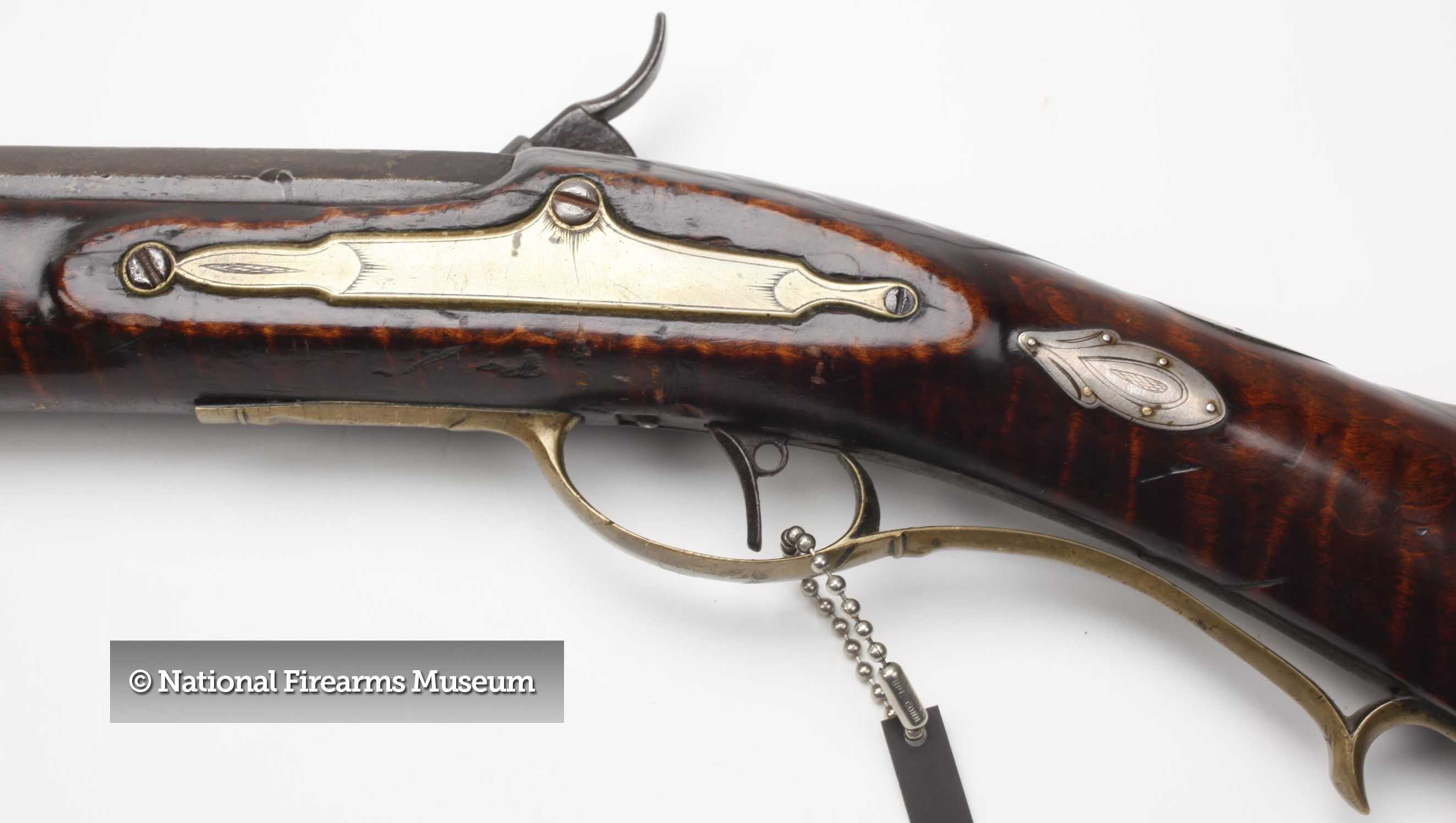 The lock bolt plate and mating stock panel on the Peter White Pennsylvania long rifle.