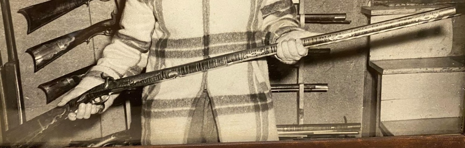 This is a decent quality 1958 photo of a high end percussion conversion Bedford County-style long rifle that carries dual markings for Peter White and Moses Wright.