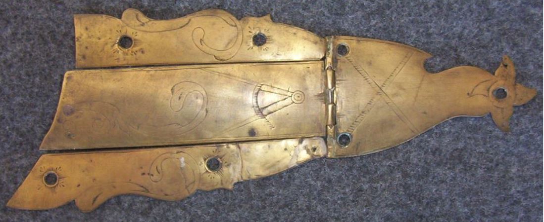 Photo of an antique unpierced patch box made by the gunsmith Peter White. The patch box, which features a Masonic symbol, was made by the Bedford and Fayette County gunsmith Peter White.