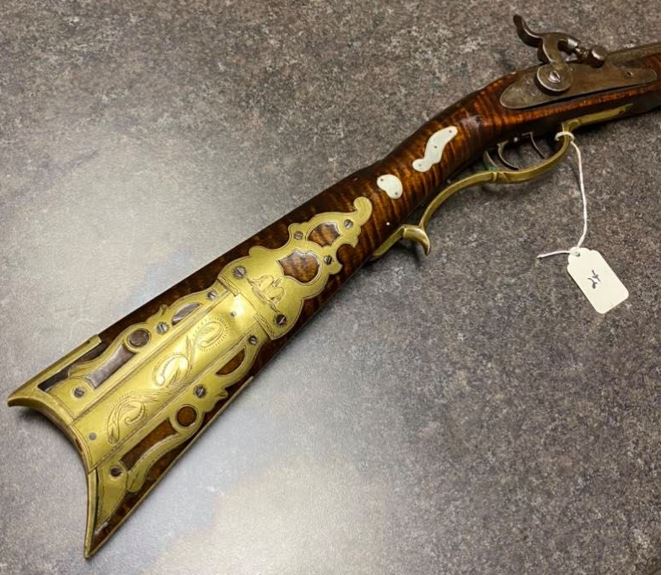A picture of the RH side of the buttstock, wrist, and lock panel portions of a Pennsylvania longrifle built by the Bedford County gunsmith Tobias Snider.