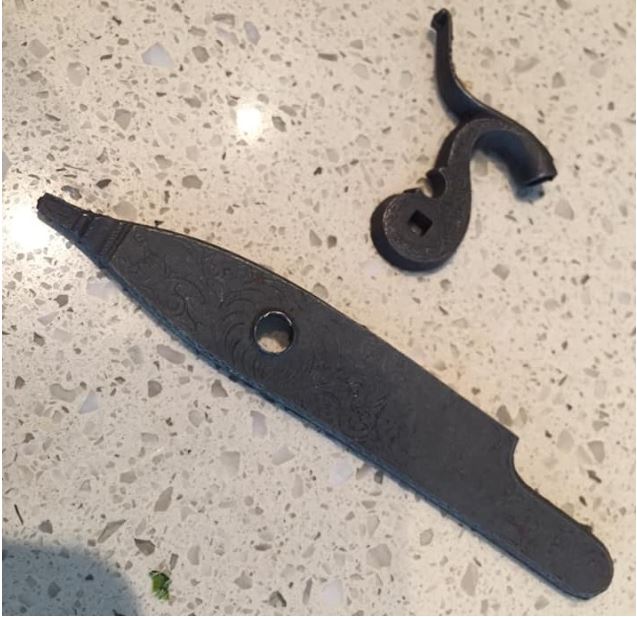 Photo of a W. G. Sutter Bedford County, Pennsylvania-style rat tail percussion lock plate and hammer.