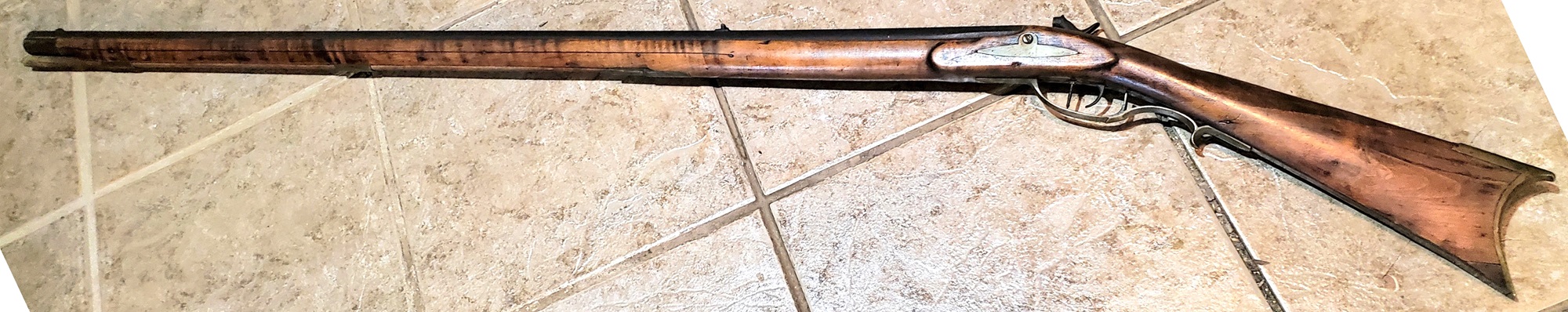 A view of the entire left-hand side of the shotgun.