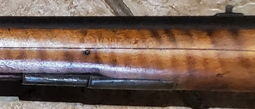 The ramrod entry pipe.