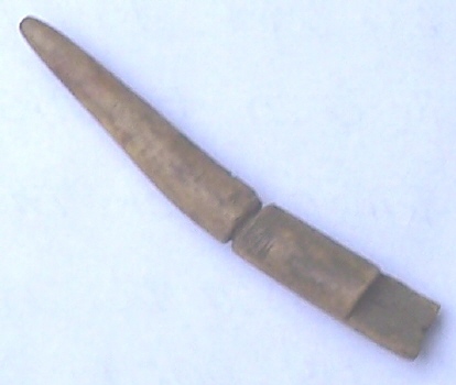 An old photo of the tine of a deer antler that has been partially formed into a powder measure.