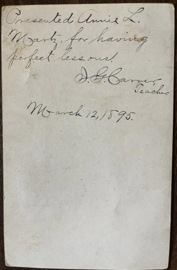 Rear of 1895 reward card.