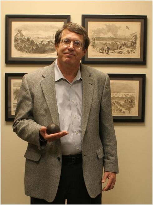 Dietle with 4 lb cannonball at his office.jpg